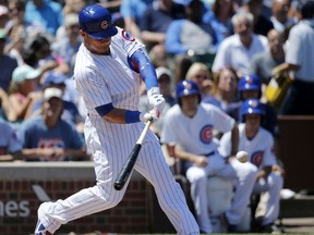 Chicago Cubs' Willson Contreras hits a three-run home run off Chicago White Sox starting pitcher Carlos Rodon during the first inning of a baseball game Tuesday, July 25, 2017, in Chicago. Ben Zobrist and Anthony Rizzo also scored on the play. (AP Photo/Charles Rex Arbogast)