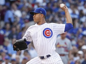 Chicago Cubs starting pitcher Jose Quintana delivers against the St. Louis Cardinals during the first inning of a baseball game, Sunday, July 23, 2017, in Chicago. (AP Photo/Kamil Krzaczynski)