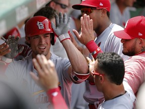 St. Louis Cardinals' Randal Grichuk celebrates his home run off Chicago Cubs starting pitcher Jake Arrieta in the dugout during the second inning of a baseball game Friday, July 21, 2017, in Chicago. (AP Photo/Charles Rex Arbogast)