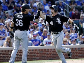 Chicago White Sox's Adam Engel (41) celebrates his home run off Chicago Cubs relief pitcher Justin Grimm with Kevan Smith during the sixth inning of a baseball game Monday, July 24, 2017, in Chicago. (AP Photo/Charles Rex Arbogast)