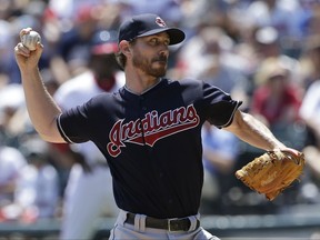 Cleveland Indians starting pitcher Josh Tomlin throws against the Chicago White Sox during the first inning of a baseball game Sunday, July 30, 2017, in Chicago. (AP Photo/Nam Y. Huh)