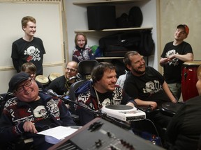 In this picture taken on Tuesday, May 2, 2017, members of the Tap Tap orchestra rehearse at their studio in Prague, Czech Republic. What was created some 18 years ago in efforts to give kids some extracurricular activity at a renowned school for the disabled in Prague has become a major music act that has drawn millions of listeners and fans, first at home and gradually abroad. (AP Photo/Petr David Josek)