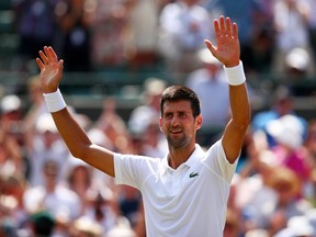 Novak Djokovic celebrates his second-round win over Adam Pavlasek at Wimbledon on July 6.