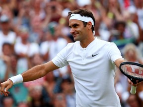 Roger Federer celebrates his victory over Mischa Zverev at Wimbledon on July 8.