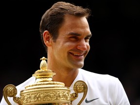 Roger Federer holds the Wimbledon trophy on July 16.