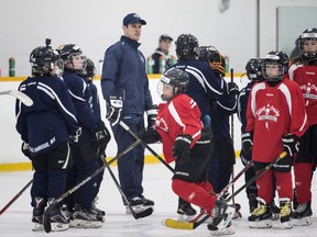 Pittsburgh Penguins' Sidney Crosby helps organize a drill during an on-ice session at the Sidney Crosby Hockey School in Halifax on Wednesday, July 12, 2017.
