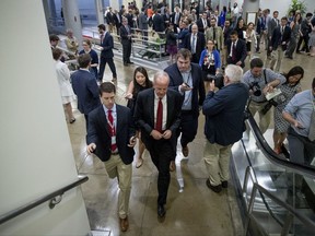 Sen. Jerry Moran, R-Kan. is pursued by reporters as he arrives on Capitol Hill in Washington, Tuesday, July 18, 2017. (AP Photo/Andrew Harnik)