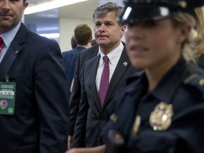 FBI Director nominee Christopher Wray walks on Capitol Hill in Washington, Tuesday, July 18, 2017. (AP Photo/Andrew Harnik)