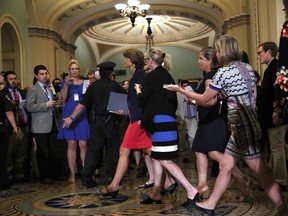 Sen. Lisa Murkowski, R-Alaska, center, is followed by reporters as she arrives to vote on Capitol Hill in Washington, Tuesday, July 25, 2017. Murkowski voted no, and Vice President Mike Pence then broke a 50-50 tie to start debating Republican legislation to tear down much of the Obama health care law. (AP Photo/Jacquelyn Martin)