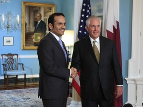 Secretary of State Rex Tillerson shakes hand with Qatar's Foreign Minister Sheikh Mohammed bin Abdulrahman Al Thani during a meeting at the State Department in Washington, Wednesday, July 26, 2017. (AP Photo/Manuel Balce Ceneta)