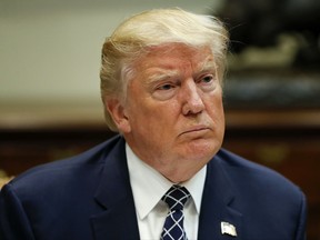 President Donald Trump listens while having lunch with services members in the Roosevelt Room of the White House in Washington, Tuesday, July 18, 2017. (AP Photo/Pablo Martinez Monsivais)