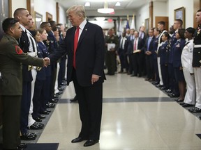 President Donald Trump greets military personnel during his visit to the Pentagon, Thursday, July 20, 2017. (AP Photo/Pablo Martinez Monsivais)
