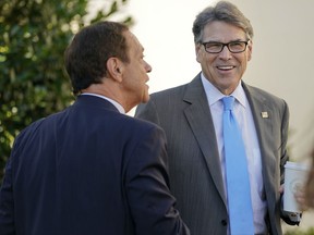 Energy Secretary Rick Perry, right, talks with former "Saturday Night Live" comedian and radio host Joe Piscopo, left, at the White House in Washington, Tuesday, July 25, 2017. The White House is hosting a Regional Media Day with live radio broadcast from the White House Driveway and interviews with White House senior staff, Cabinet members and agency staffers. (AP Photo/Pablo Martinez Monsivais)