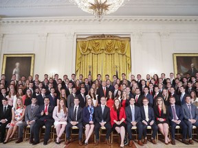 President Donald Trump, center, poses for a photo with outgoing White House interns in the East Room of the White House in Washington, Monday, July 24, 2017. (AP Photo/Pablo Martinez Monsivais)