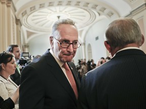 Senate Minority Leader Chuck Schumer of N.Y., left, and Sen. Bob Menendez, D-N.J.,, right, meet with members of the media on Capitol Hill in Washington, Tuesday, July 11, 2017. (AP Photo/Pablo Martinez Monsivais)