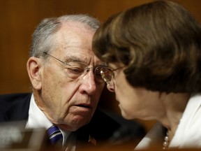 Senate Judiciary Committee Chairman Sen. Chuck Grassley, R-Iowa, talks with the Committee's ranking member Sen. Dianne Feinstein, D-Calif., on Capitol Hill in Washington, Wednesday, July 12, 2017, during the committee's confirmation hearing for FBI Director nominee Christopher Wray.  (AP Photo/Pablo Martinez Monsivais)