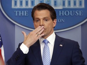 Incoming White House communications director Anthony Scaramucci, right, blowing a kiss after answering questions during the press briefing in the Brady Press Briefing room of the White House in Washington, Friday, July 21, 2017. (AP Photo/Pablo Martinez Monsivais)