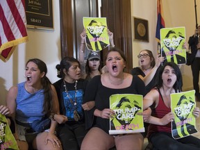 Activists protest against the Republican health care bill outside the offices of Sen. Jeff Flake, R-Ariz., and Sen. Ted Cruz, R-Texas, Monday, July 10, 2017, on Capitol Hill in Washington. (AP Photo/J. Scott Applewhite)