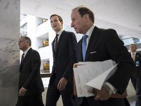 White House senior adviser Jared Kushner, center, and his attorney Abbe Lowell, right, depart Capitol Hill in Washington, Monday, July 24, 2017, after a closed-door interview with Senate Intelligence Committee investigators looking into Russia's election meddling and possible ties to the Trump Administration. (AP Photo/J. Scott Applewhite)