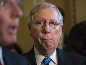 Senate Majority Leader Mitch McConnell of Ky. listens as Sen. John Barrasso, R-Wyo. speaks during a news conference on Capitol Hill in Washington, Tuesday, July 11, 2017, following a closed-door Republican strategy session. (AP Photo/J. Scott Applewhite)