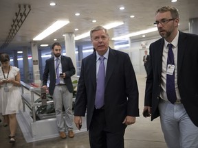 Sen. Lindsey Graham, R-S.C., arrives at the Senate for final votes of the week on the day after Sen. John McCain, R-Ariz., was diagnosed with an aggressive type of brain cancer, on Capitol Hill in Washington, Thursday, July 20, 2017. Sen. Graham, McCain's closest friend in the Senate, said that they had spoken by telephone Wednesday night and that the diagnosis had been a shock to McCain. "John has never been afraid of is death," said Graham, of McCain, 80, a Vietnam veteran and former prisoner of war. (AP Photo/J. Scott Applewhite)