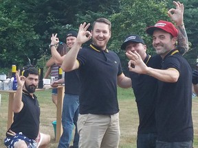 So-called "Proud Boys" salute founder Gavin McInnes in a social media post on July 4. They are wearing the Fred Perry shirts the group favours.