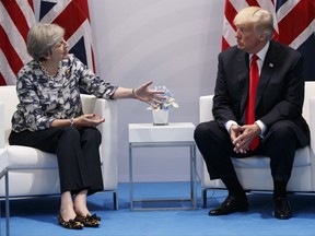 U.S. President Donald Trump meets with British Prime Minister Theresa May at the G20 Summit, Saturday, July 8, 2017, in Hamburg, Germany. (AP Photo/Evan Vucci)