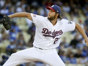 Los Angeles Dodgers starting pitcher Clayton Kershaw throws against the Arizona Diamondbacks during the first inning of a baseball game in Los Angeles, Tuesday, July 4, 2017. (AP Photo/Chris Carlson)