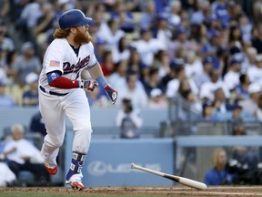 Los Angeles Dodgers' Justin Turner watches his RBI-single against the Arizona Diamondbacks during the first inning of a baseball game in Los Angeles, Tuesday, July 4, 2017. (AP Photo/Chris Carlson)