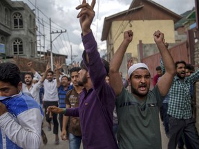 Supporters of Jammu Kashmir Liberation Front (JKLF) shout slogans during a protest march towards UN Military Observer Group headquarters in Srinagar, Indian controlled Kashmir, Friday, July 21, 2017. (AP Photo/Dar Yasin)