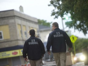 U.S. Marshals monitor activity outside the Martin Luther King, Jr. Federal Courthouse before opening statements are heard in the "Bridgegate" trial on Sep. 19, 2016 in Newark, New Jersey.