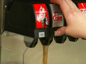 A Diet Coke is poured on a Big Gulp cup at a 7-Eleven store