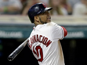 Edwin Encarnacion of the Cleveland Indians follows the flight of the ball after banging out an RBI single against the Toronto Blue Jays Friday night at Progressive Field in Cleveland. Encarnacion had four RBI on the night against his former team in a 13-3 Indians' rout.