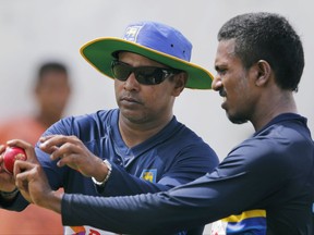 Sri Lanka's fast bowling coach Chaminda Vaas, left, instructs bowler Vishwa Fernando during a training session ahead of the first test cricket match against India in Galle, Sri Lanka, Tuesday, July 25, 2017. (AP Photo/Eranga Jayawardena)