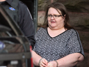 Elizabeth Wettlaufer is escorted by police from the courthouse in Woodstock, Ont, Monday, June 26, 2017.