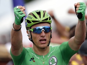 Germany's Marcel Kittel, wearing the best sprinter's green jersey celebrates as he crosses the finish line to win the tenth stage of the Tour de France cycling race over 178 kilometers (110.6 miles) with start in Perigueux and finish in Bergerac, France, Tuesday, July 11, 2017. (AP Photo/Christophe Ena)