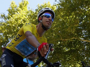 Italy's Fabio Aru, wearing the overall leader's yellow jersey arrives for the start of the fourteenth stage of the Tour de France cycling race over 181.5 kilometers (112.8 miles) with start in Blagnac and finish in Rodez, France, Saturday, July 15, 2017. (AP Photo/Peter Dejong)