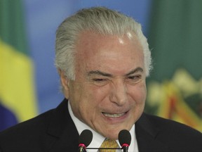 Brazil's President Michel Temer speaks during a ceremony in Brasilia, Brazil, Wednesday, July 12, 2017. The Senate gave final congressional approval to an unpopular overhaul of Brazil's labor laws Tuesday night, providing crucial political support to embattled Temer as he fights a damaging corruption accusation. (AP Photo/Eraldo Peres)