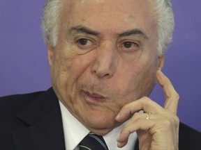 Brazil's President Michel Temer attends a ceremony at the Planalto Presidential Palace, in Brasilia, Brazil, Thursday, July 6, 2017. Temer has quickly presented to lawmakers his legal defense against corruption allegations in a move seen as a bid to avoid being suspended from office and put on trial. (AP Photo/Eraldo Peres)