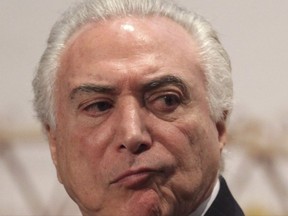 Brazil's President Michel Temer attends a ceremony in Brasilia, Brazil, Tuesday, July 11, 2017. Temer has quickly presented to lawmakers his legal defense against corruption allegations in a move seen as a bid to avoid being suspended from office and put on trial. (AP Photo/Eraldo Peres)