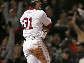 FILE - In this Oct. 17, 2004, file photo, Boston Red Sox's Dave Roberts celebrates after scoring the tying run against New York Yankees in the ninth inning of Game 4 of the ALCS in Boston. Roberts leans on his mother-in-law to handle the influx of fan mail he still receives daily from appreciative folks in Boston. (AP Photo/Charles Krupa, File)
