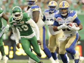 Winnipeg Blue Bombers running back Andrew Harris moves the ball upfield during first half CFL action against the Saskatchewan Roughriders at the new Mosaic Stadium in Regina on Saturday night.