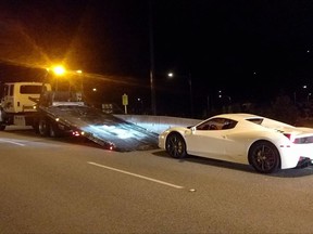 A 2015 Ferrari 458 is seen in this undated police handout photo. West Vancouver Police say they stopped a 22-year-old driver who was clocked travelling at 210 kilometres per hour in a 60 kilometre per hour zone on the Lions Gate Bridge. The driver's 2015 Ferrari 458 has been impounded for seven days and the West Vancouver resident has been ordered to appear in court in September on charges of excessive speed and driving without due care and attention. THE CANADIAN PRESS/HO, West Vancouver Police *MANDATORY CREDIT*