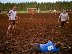 Teams battle the mud as much as each other while playing swamp soccer, in Hyrynsalmi, Finland, in July of 2017.