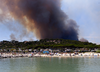 Smoke rises from burning wildfires near Lavandou, French Riviera, on Wednesday.