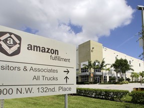 This Wednesday, July 19, 2017, photo shows an Amazon Fulfillment Center in Miami. On Wednesday, July 26, 2017, Amazon said that it's looking to fill more than 50,000 positions across its U.S. fulfillment network. It's planning to make thousands of job offers on the spot during its first Jobs Day on Aug. 2, where potential employees will have a chance to see what it's like to work at Amazon by visiting one of 10 participating fulfillment centers. (AP Photo/Alan Diaz)