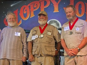 Michael Groover, center, husband of celebrity chef Paula Deen, competes in the 2017 Hemingway Look-Alike Contest Thursday, July 20, 2017, at Sloppy Joe's Bar in Key West, Fla. Some 160 contestants are registered for this year's competition that is part of Key West's annual Hemingway Days festival.