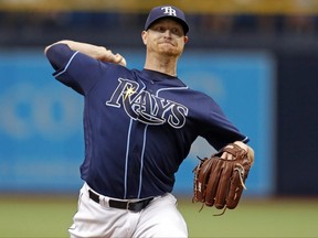 Tampa Bay Rays starting pitcher Alex Cobb throws during the first inning of a baseball game against the Boston Red Sox, Saturday, July 8, 2017, in St. Petersburg, Fla. (AP Photo/Mike Carlson)