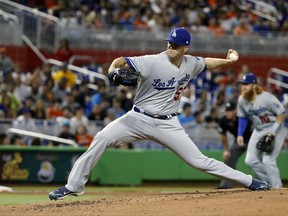 Los Angeles Dodgers' Alex Wood delivers a pitch during the first inning of a baseball game against the Miami Marlins, Saturday, July 15, 2017, in Miami. (AP Photo/Wilfredo Lee)