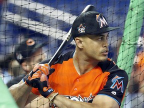 National League's Miami Marlins outfielder Giancarlo Stanton (27), practices before the MLB baseball All-Star Game, Tuesday, July 11, 2017, in Miami. (AP Photo/Wilfredo Lee)